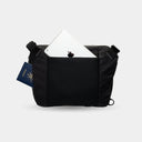 Compact daily sling for cameras and tech. Ergonomic padding, waterproof body, and smart internal compartments.