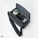 Sling bag with compact drone compartment and padded protection.